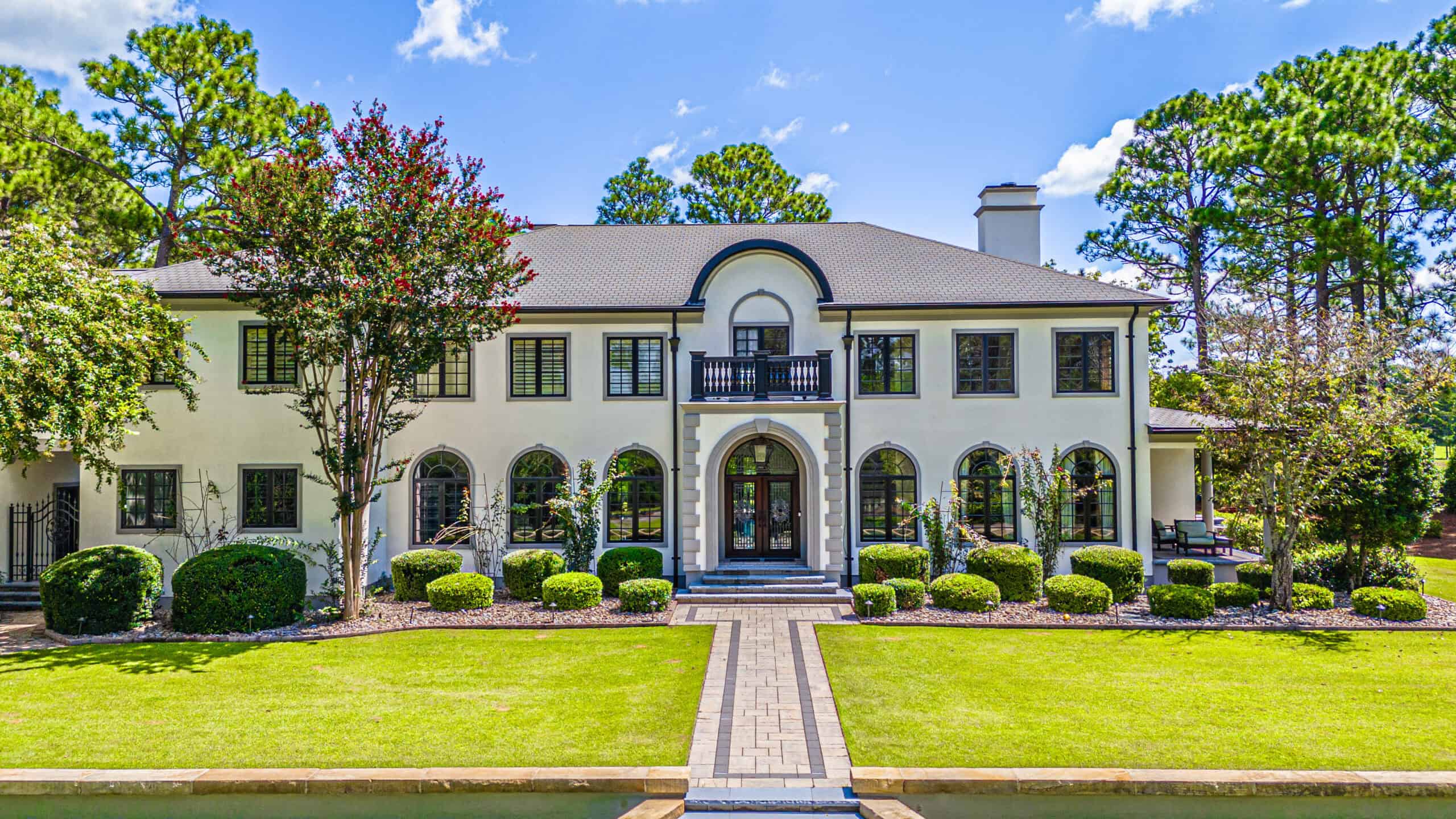 Large white stucco estate exterior painted by Painters in Southern Pines, NC