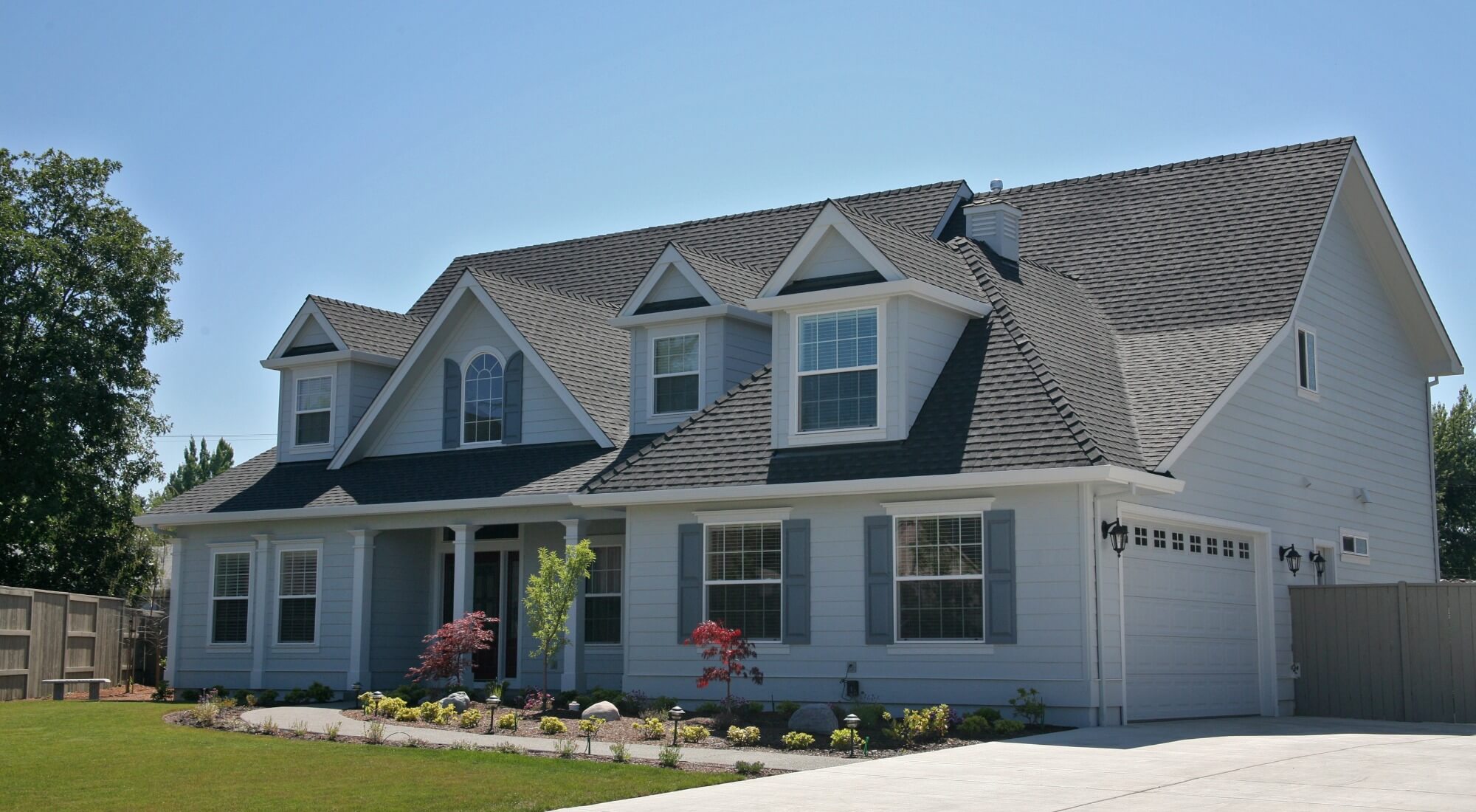 Gray home with white trim, exterior house painting in Southern Pines, NC