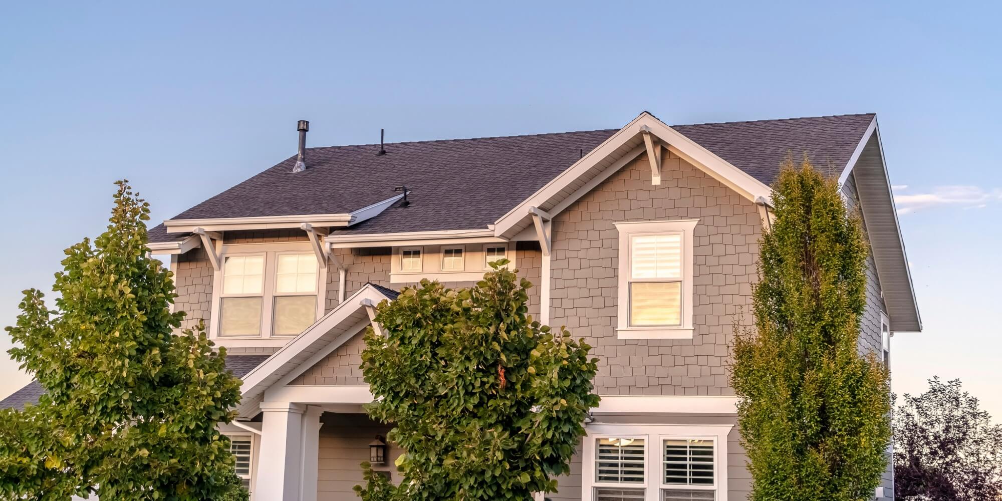Tan shingle-style home exterior with painting tips for Southern Pines, NC