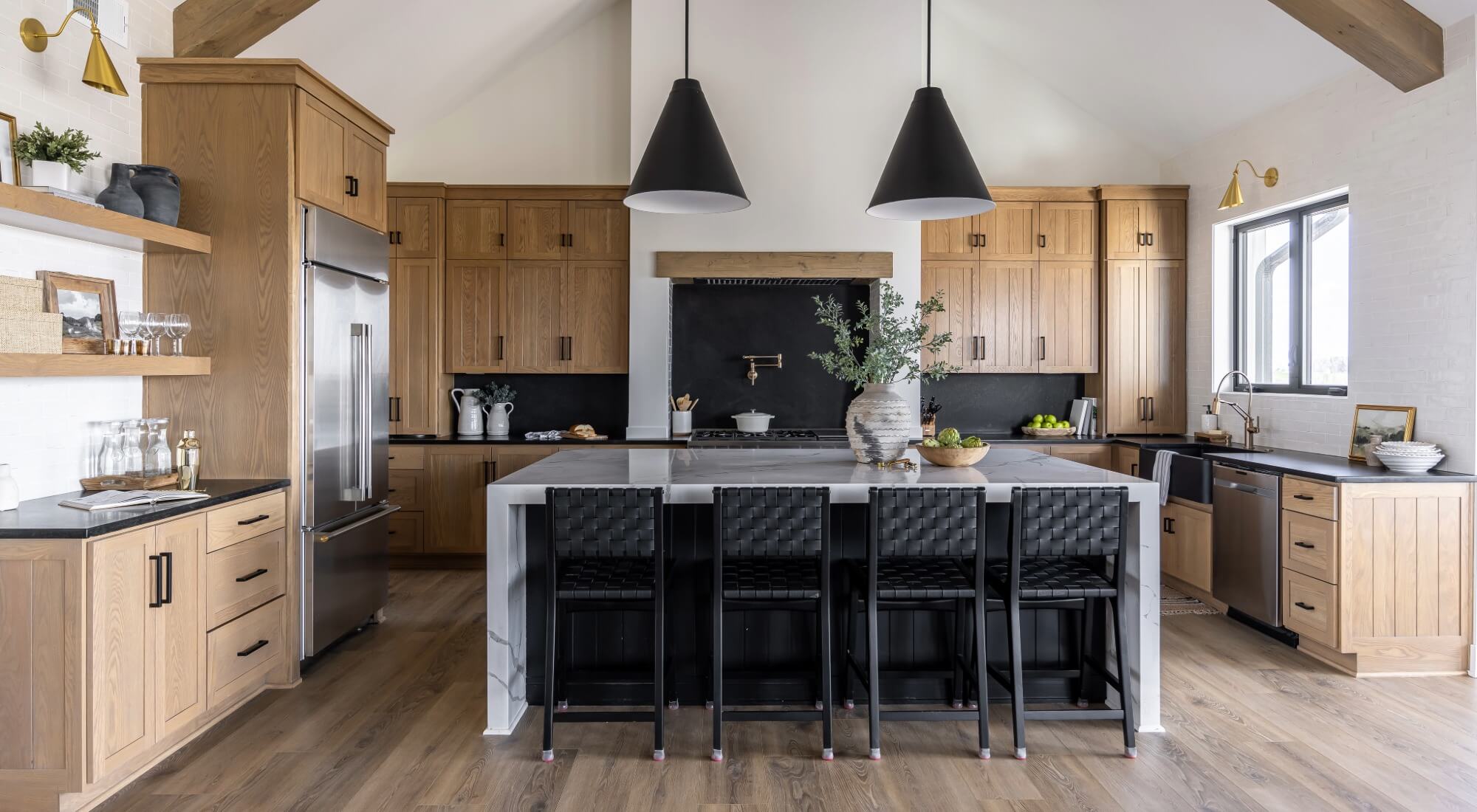 Modern kitchen with wood cabinets and black island, painters in Aberdeen, NC